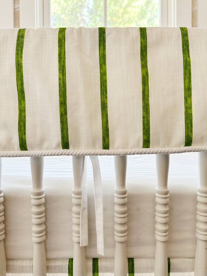 Close view of the brushed green stripes on textured white cotton, the white cording edge and a slim white tie