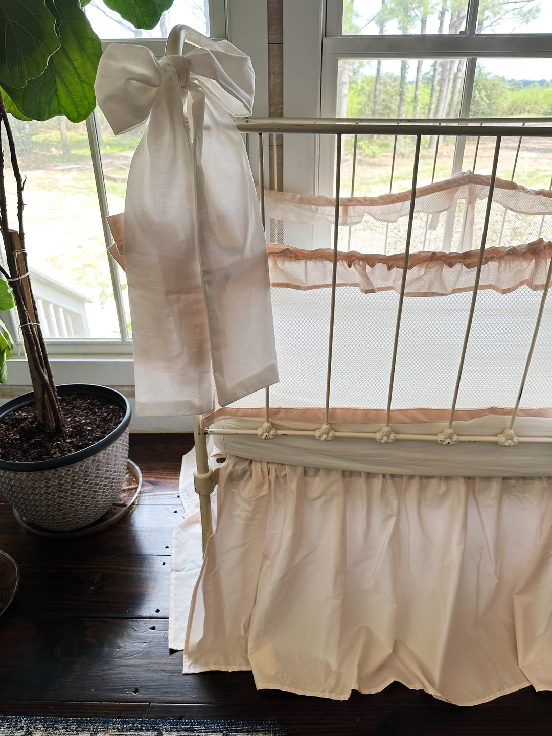 Tied crib liner showing secure crib rail attachment