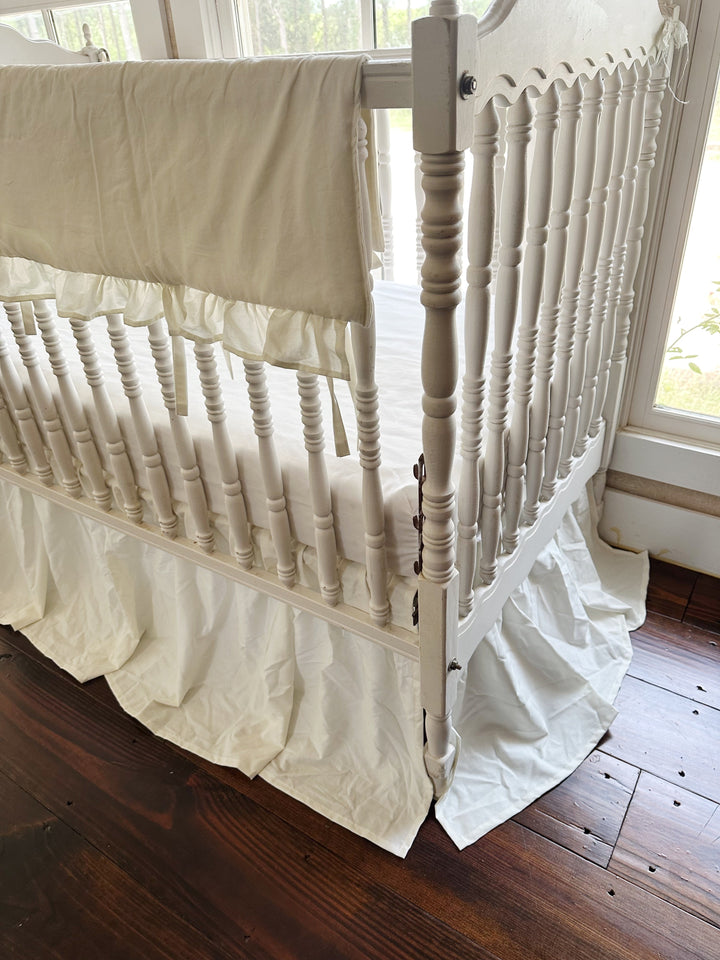 Angled view of the porcelain set showing the rail cover ties and the skirt falling to the floor