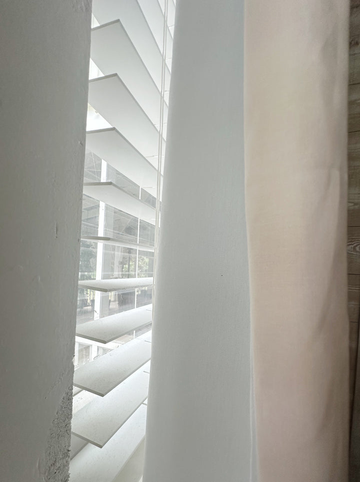 Edge of a Ballet Slipper Pink panel beside its white lined back, with window blinds behind