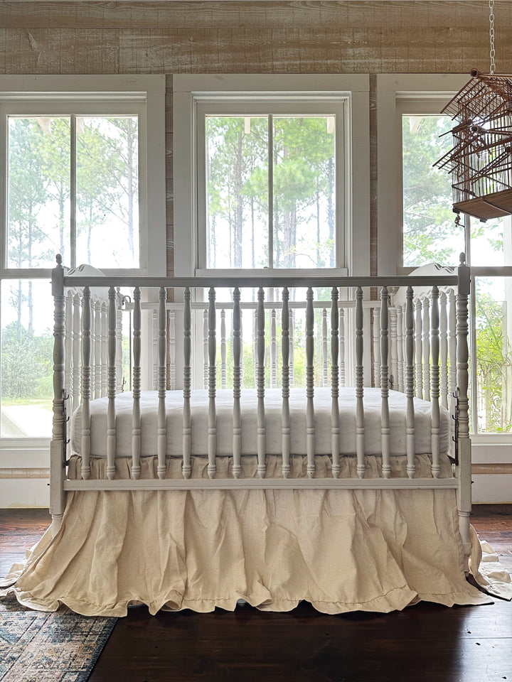 Handmade crib skirt in natural osnaburg with a linen-like washed cotton texture - High Cotton Textile