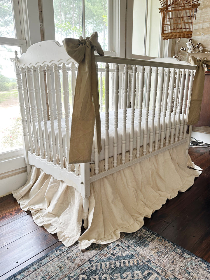 Natural osnaburg ruffled crib skirt with a 22 inch drop in a gender neutral nursery - High Cotton Textile