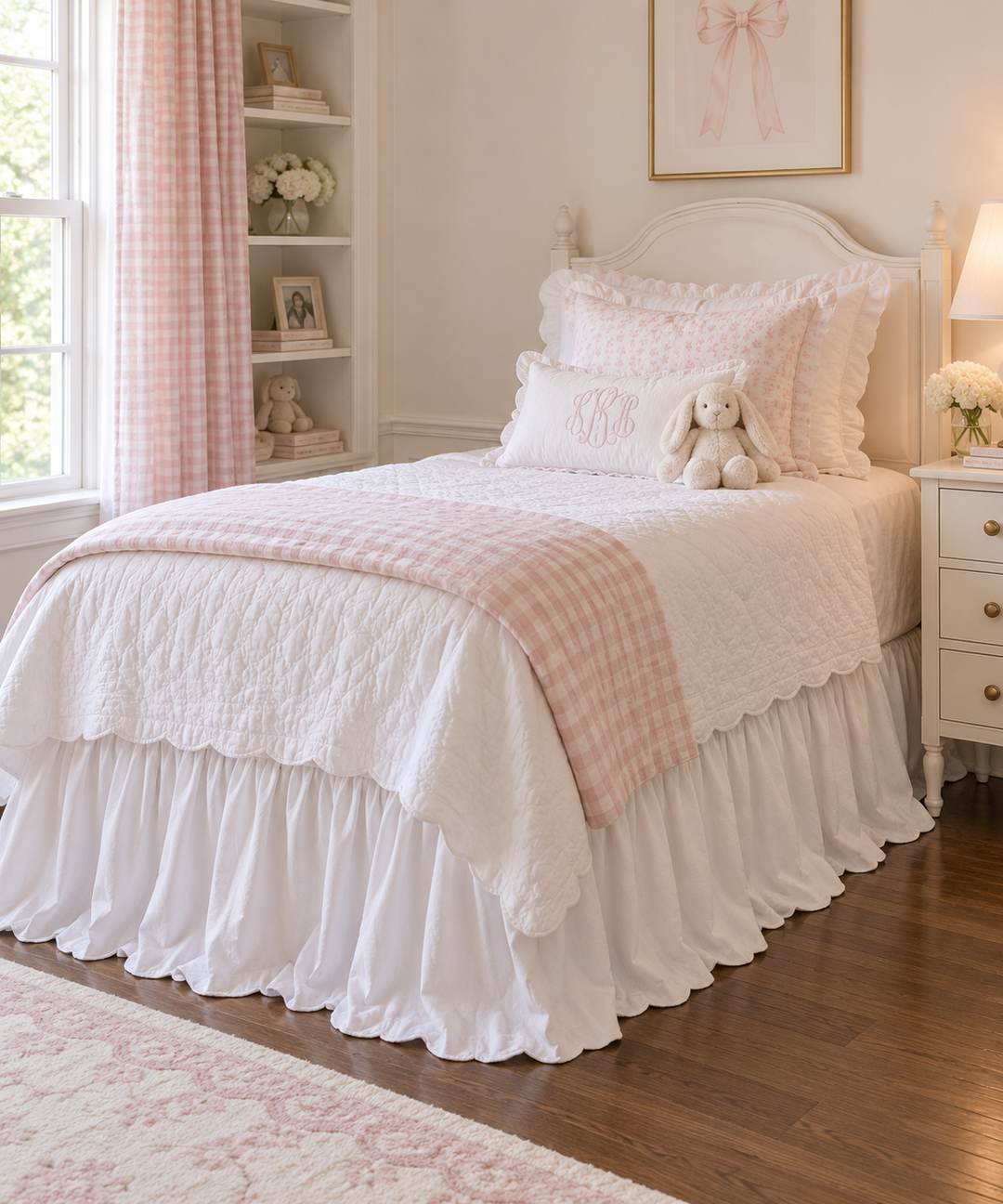 White ruffled twin bed skirt beside a white nightstand in a pink and white girl's room - High Cotton Textile