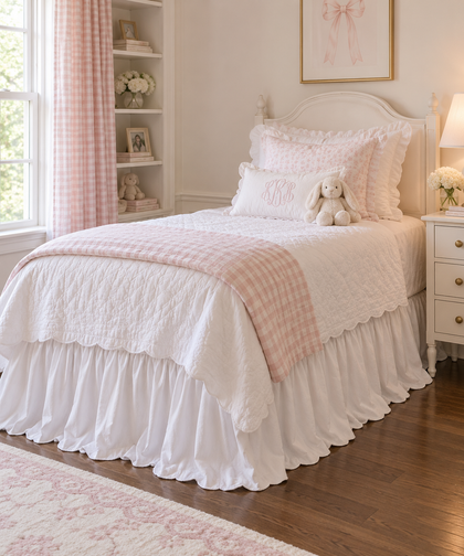 White ruffled twin bed skirt beside a white nightstand in a pink and white girl's room - High Cotton Textile