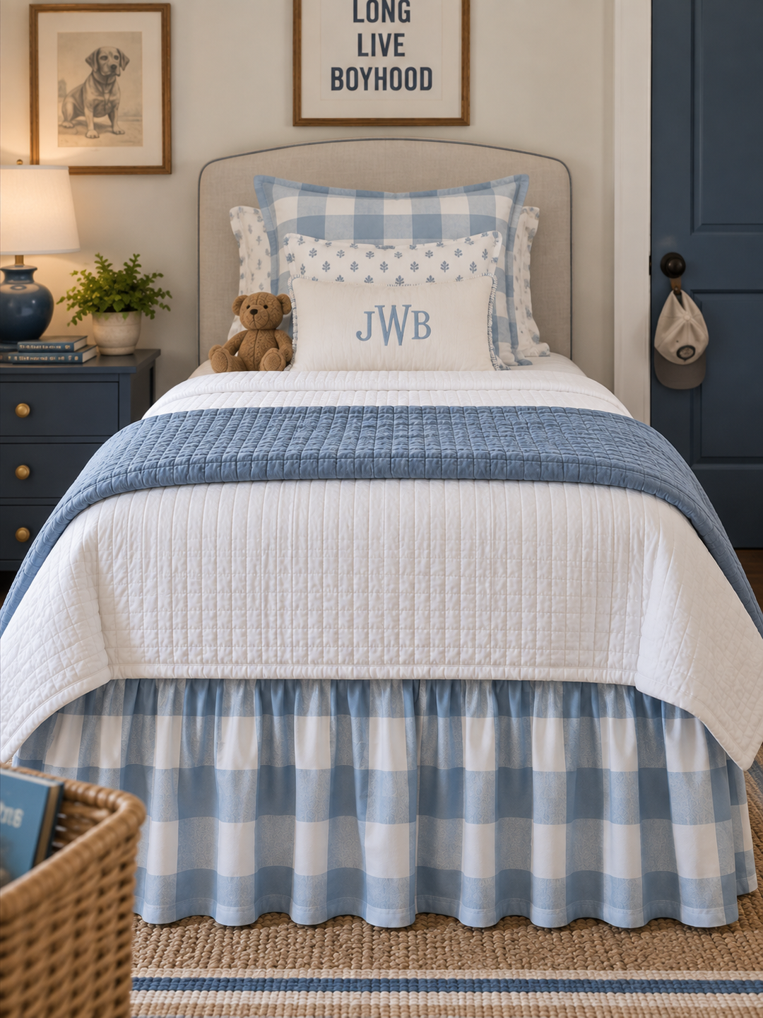 Straight on view from the foot of a twin bed showing the blue buffalo check bed skirt across the full width - High Cotton Textile