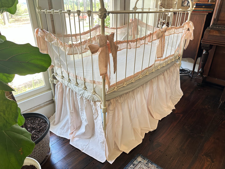 Four-piece farmhouse ruffled mesh crib liners displayed together, highlighting airy, soft cotton mesh