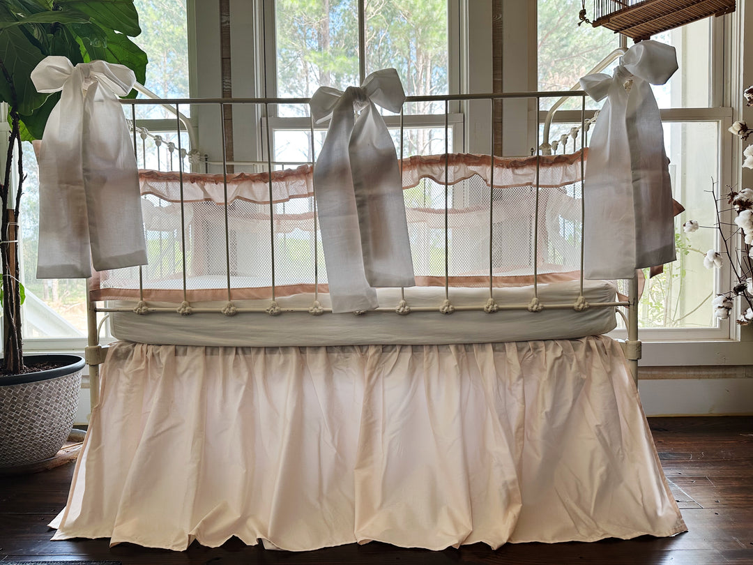 Three large crib bows arranged on crib