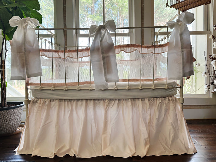 Three large crib bows arranged on crib