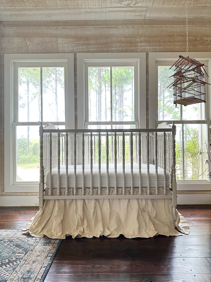 Natural osnaburg ruffled crib skirt fitted to a standard crib mattress - High Cotton Textile