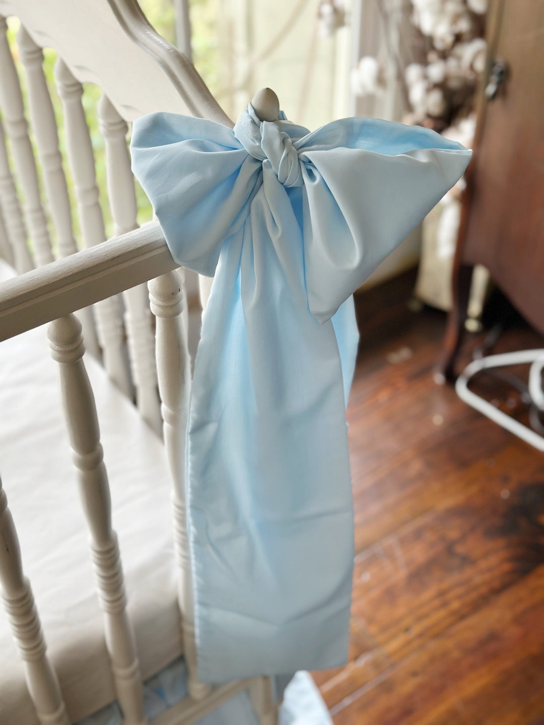 Angled close view of the knot and the drape of the washed cotton sash