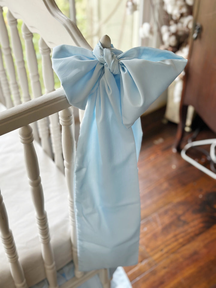 Angled close view of the knot and the drape of the washed cotton sash