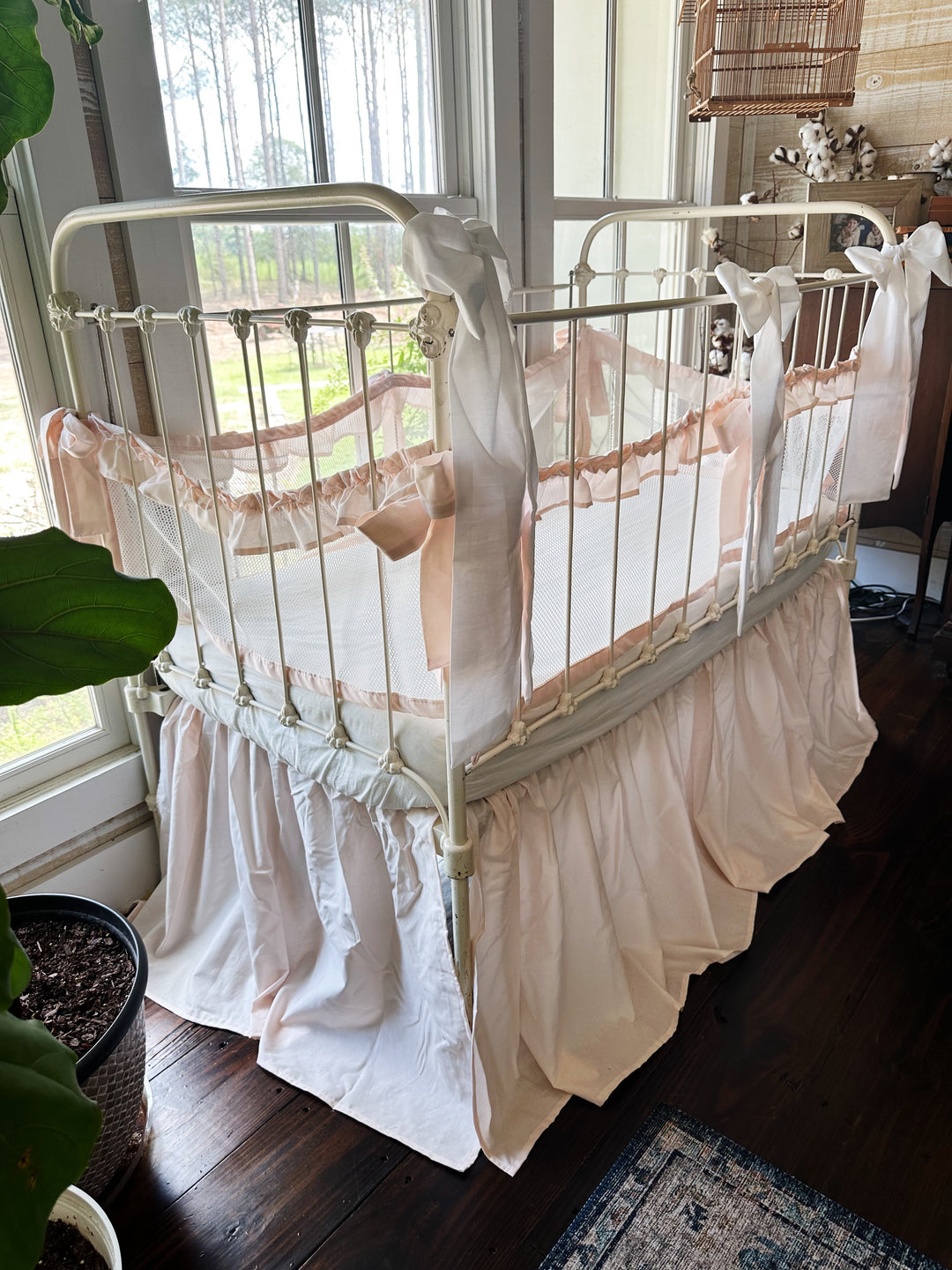 Full crib with 4-piece mesh liners and crib skirt in ballet slipper pink