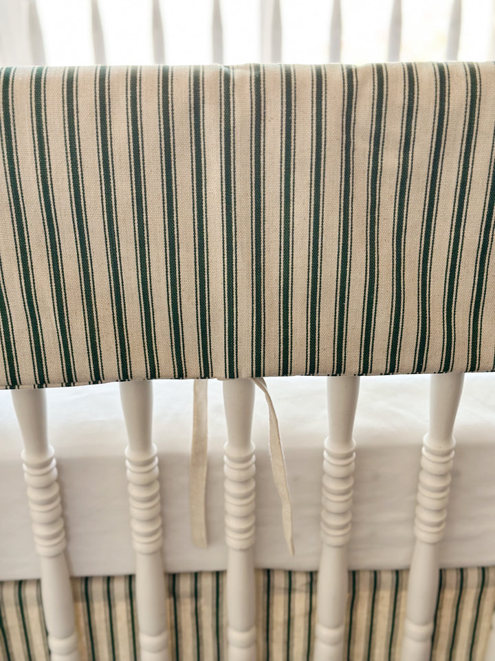Close view of the woven green ticking stripe and a single narrow natural osnaburg tie