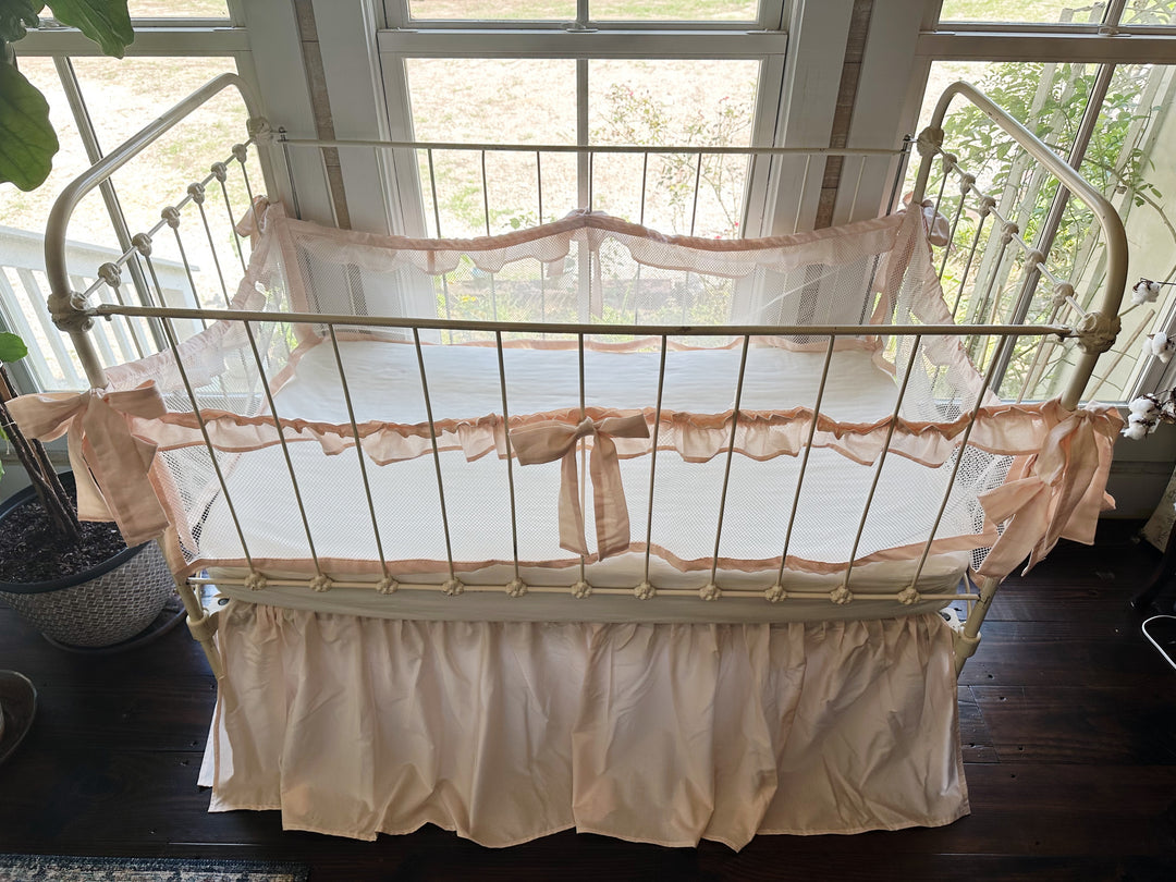 Lifestyle nursery shot with crib bedding set, coordinating colors, and sweet farmhouse aesthetic