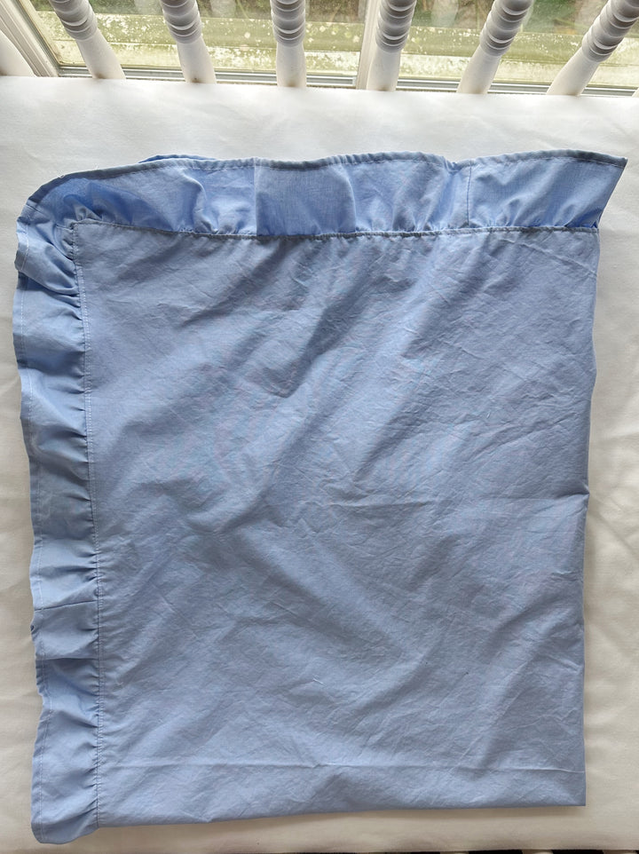 Baby blue ruffled baby blanket folded back to show the matching cotton underside and side ruffle - High Cotton Textile