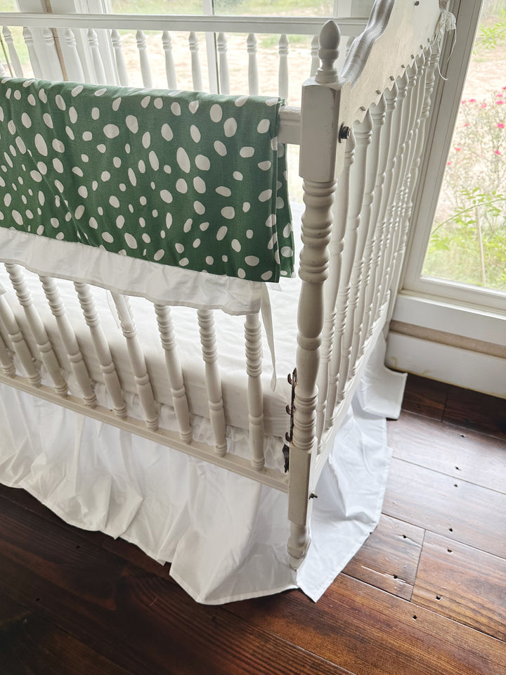 The green dot rail cover ending at the corner post above the white farmhouse skirt