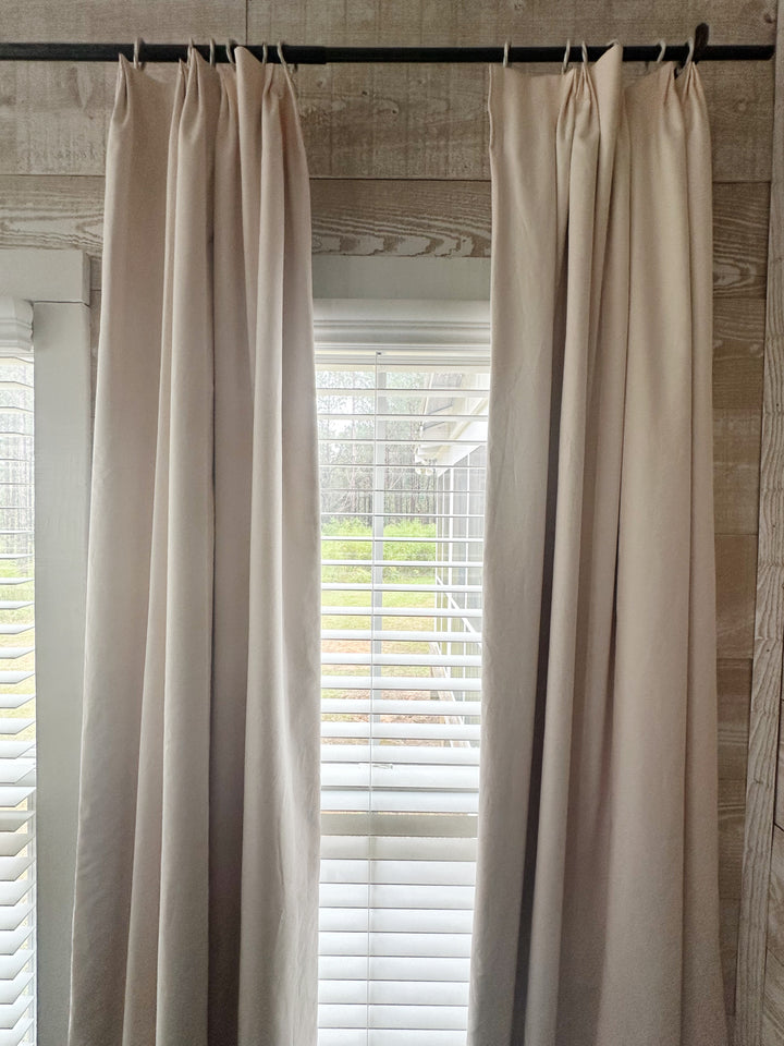 Ballet Slipper Pink euro pleat curtains hung on rings above a window, panels open to the light