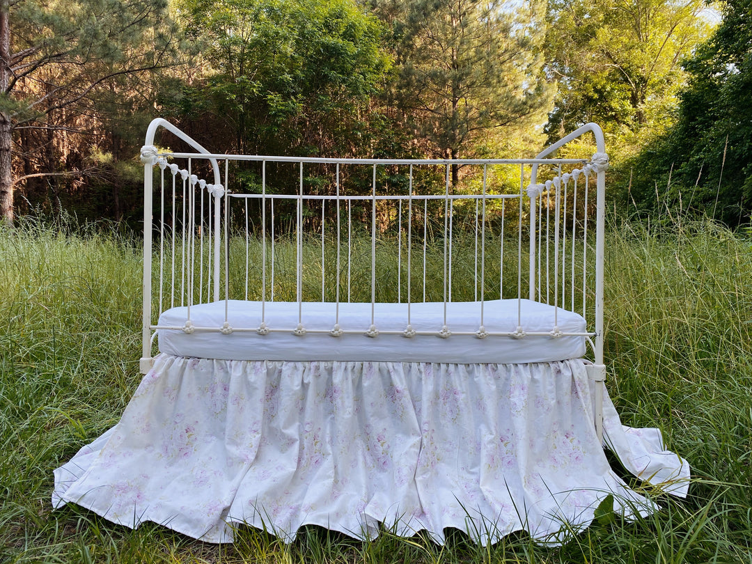 Front view of lavender floral gathered crib skirt, washed cotton, made to order