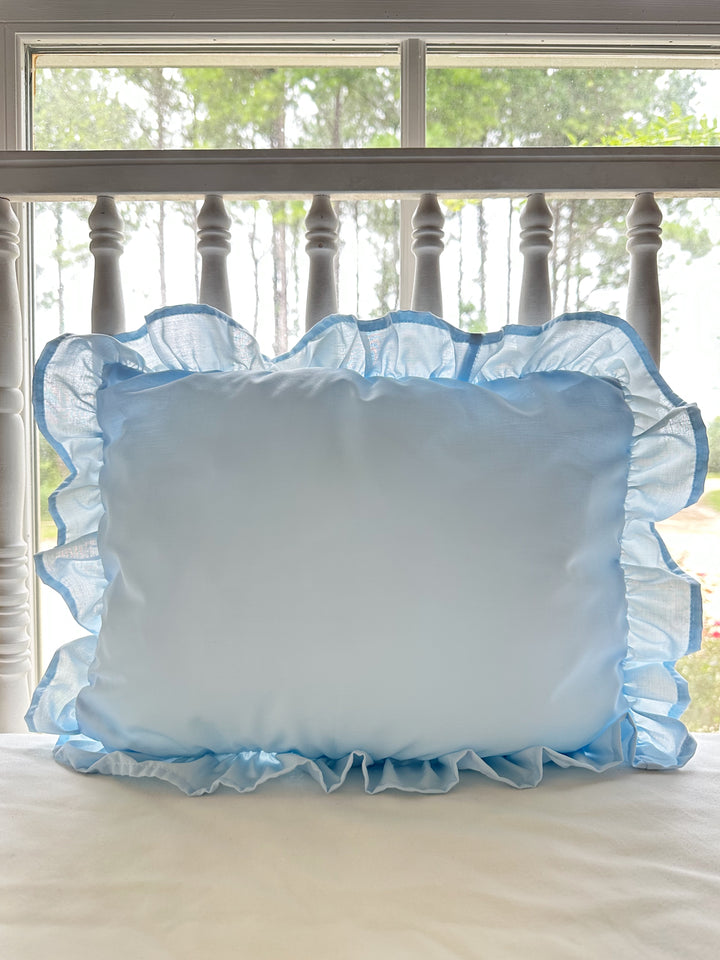 Heirloom blue ruffled crib pillow in soft washed cotton with a gathered ruffle border on all four sides - High Cotton Textile