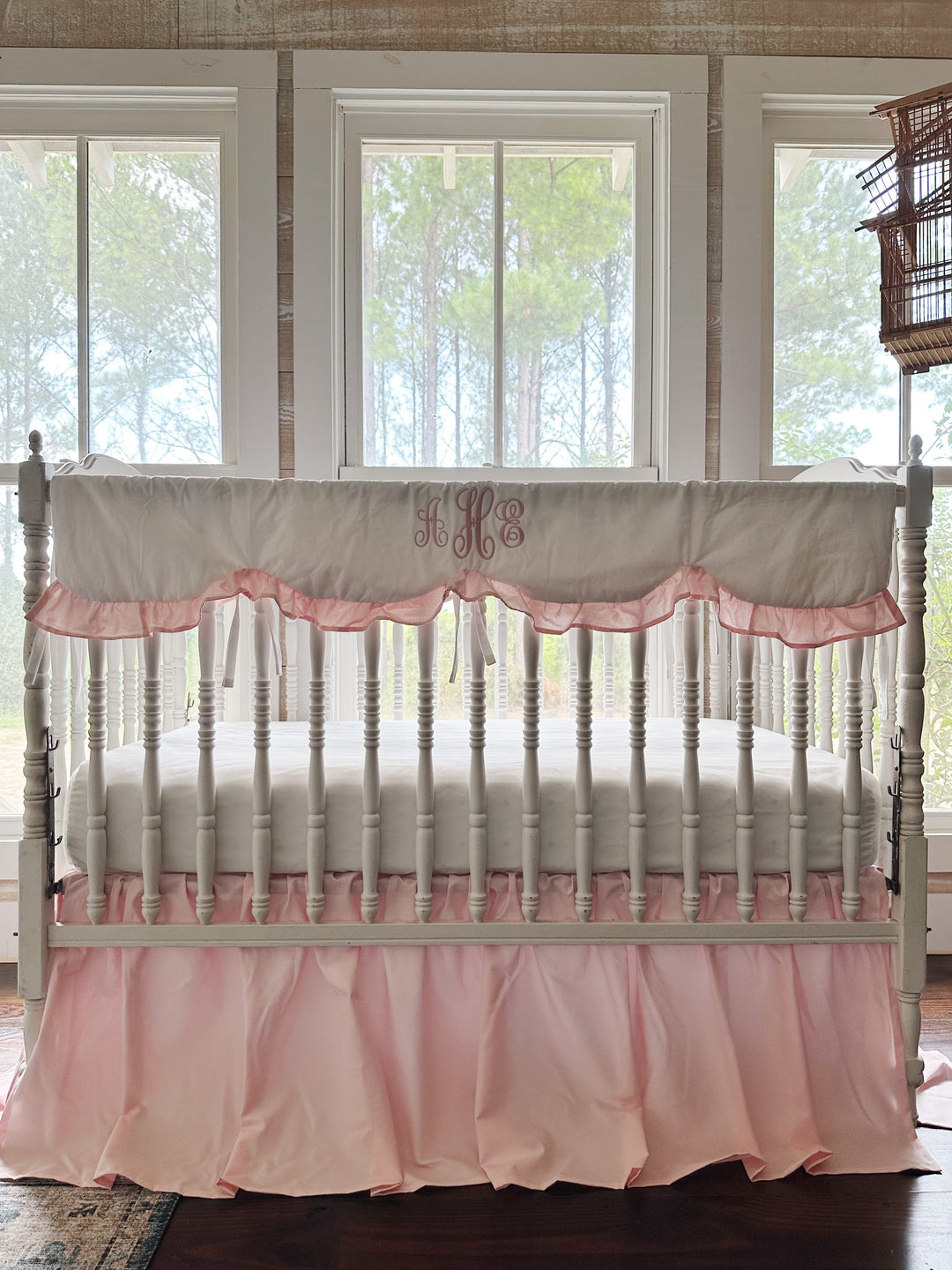 Sisters Pink two-piece crib bedding set with a monogrammed scalloped crib rail cover and gathered farmhouse crib skirt