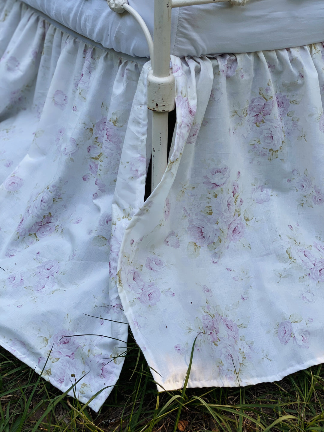 Close-up of lavender rose shabby chic floral print on washed cotton gathered crib skirt