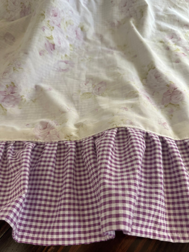 Detail of the topstitched seam where the lavender rose floral joins the gingham ruffle