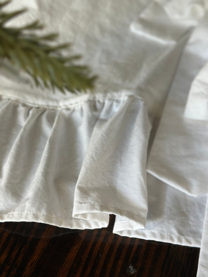Detail of the gathered ruffle seam on the white washed cotton tree skirt