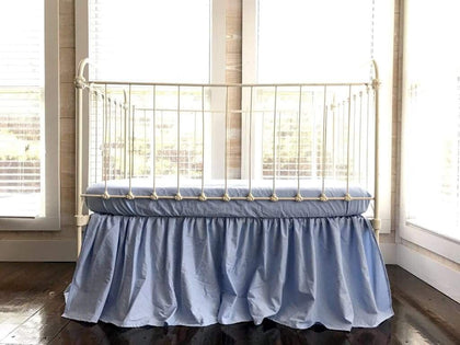 Baby blue farmhouse crib skirt, gathered on all four sides with a 20-inch drop