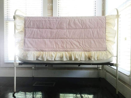 Baby pink handmade baby quilt with an ivory ruffle border