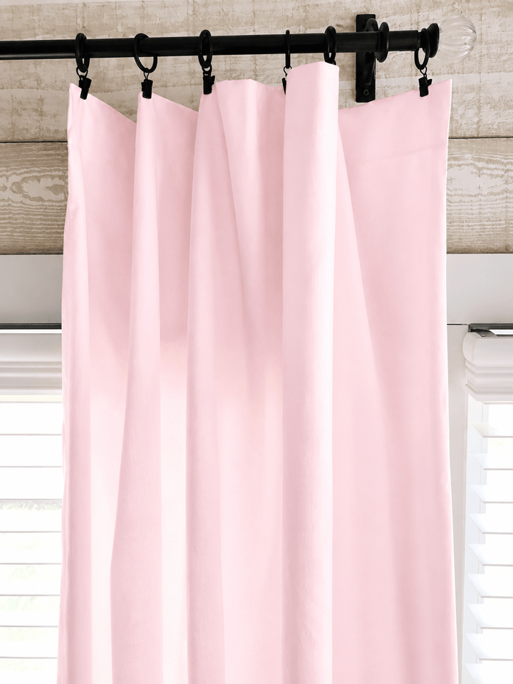 Close view of the baby pink farmhouse curtain heading on iron clip rings, showing the clean flat edge with no ruffle - High Cotton Textile