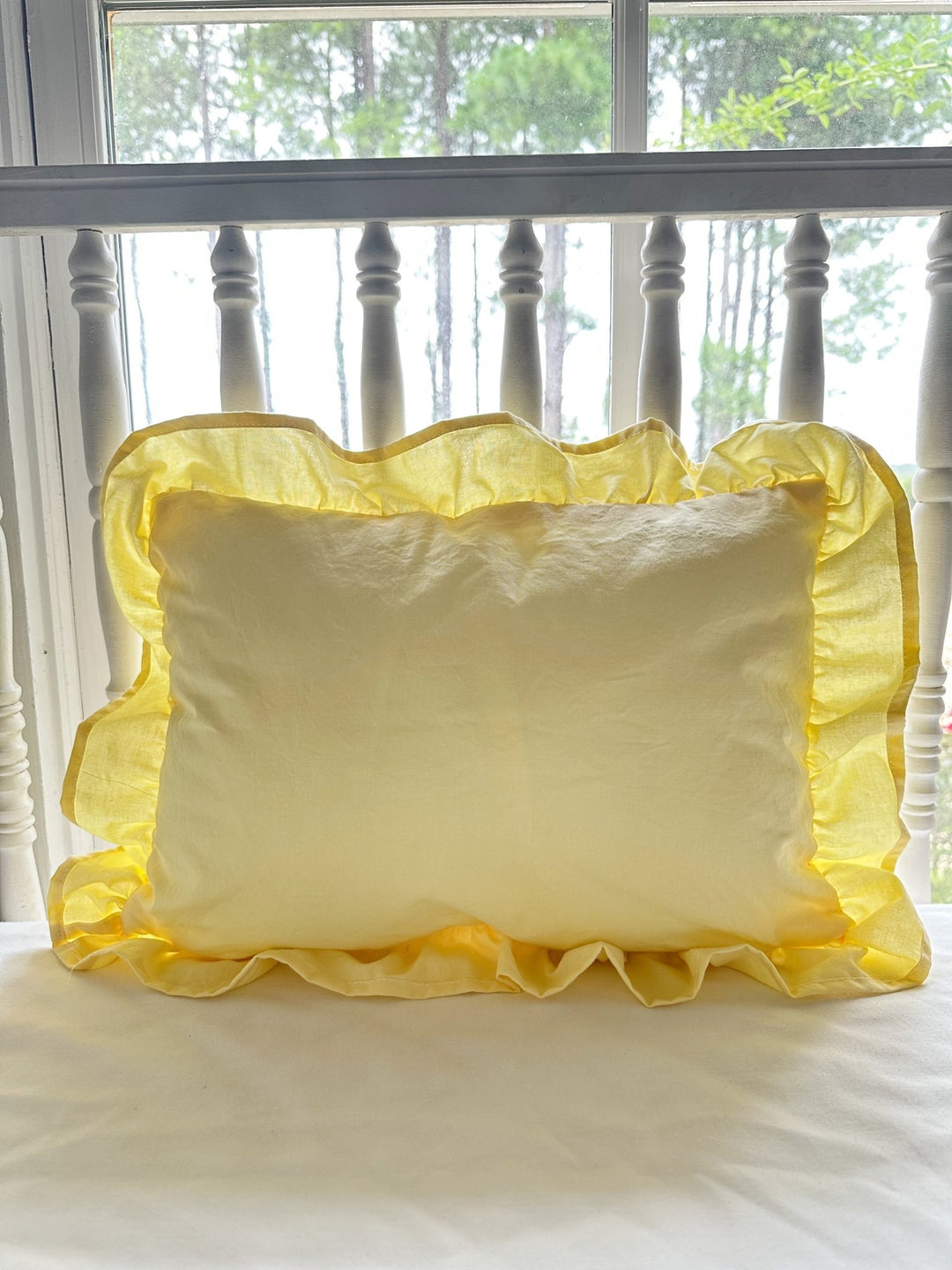 Baby yellow ruffled crib pillow without monogram showing the gathered cotton ruffle border - High Cotton Textile