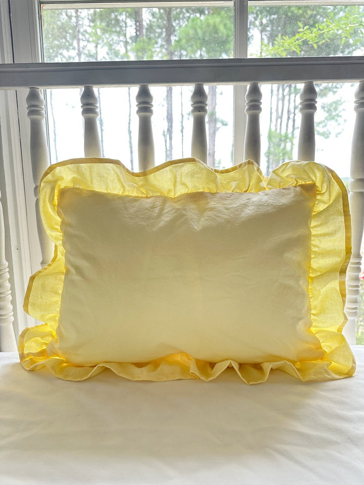 Baby yellow ruffled crib pillow without monogram showing the gathered cotton ruffle border - High Cotton Textile