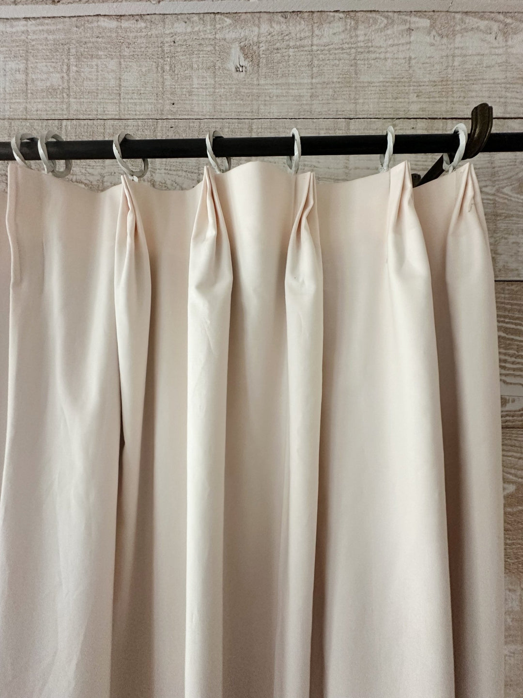 Close-up of the tailored euro pleat header on the Ballet Slipper Pink curtain, each pleat tacked at the top and hung from a white ring