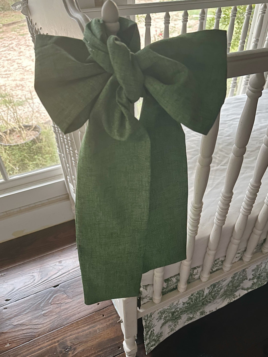 Close view of the cypress green sash showing the soft texture of the washed cotton weave