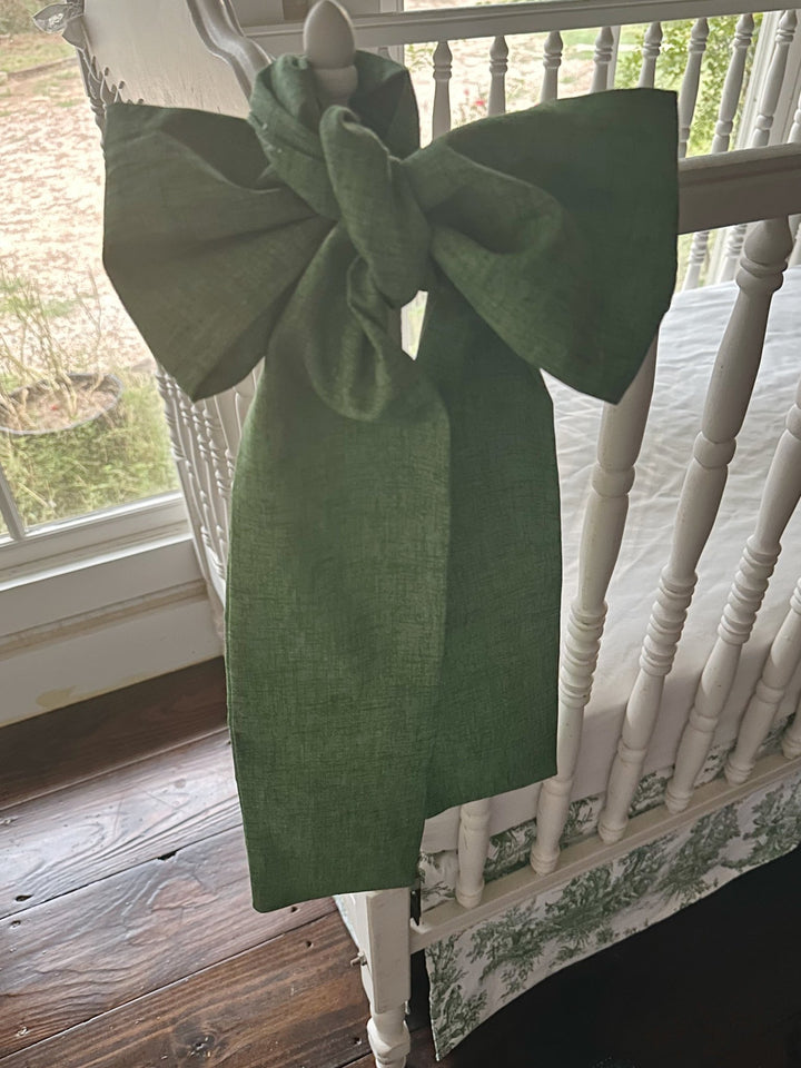 Close view of the cypress green sash showing the soft texture of the washed cotton weave