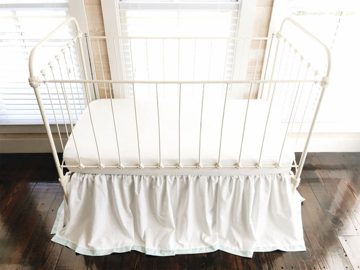 white and light green and blue farmhouse crib skirt