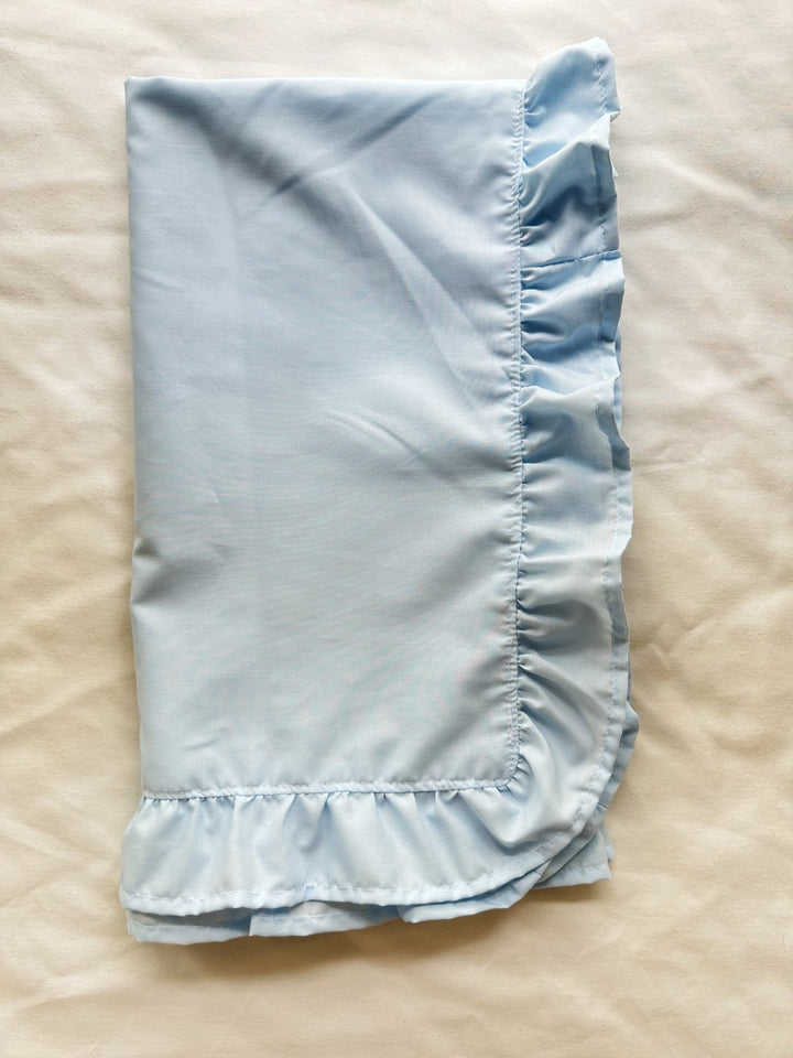 Folded heirloom blue ruffled crib blanket in soft 100% washed cotton - High Cotton Textile