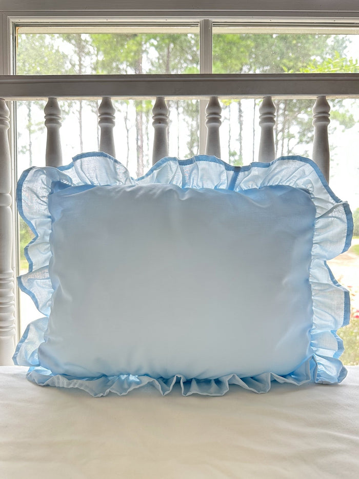 Heirloom blue ruffled crib pillow in soft washed cotton with a gathered ruffle border on all four sides - High Cotton Textile