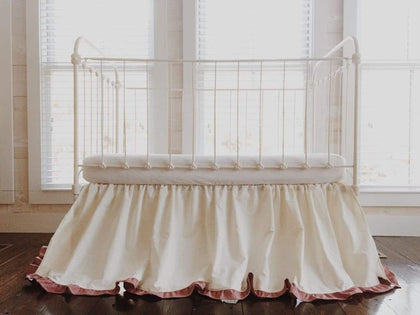 Ivory and blush ruffled crib skirt in washed cotton, 22-inch drop, gathered