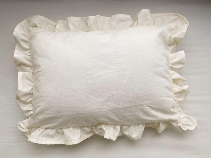 Ivory ruffled crib pillow in washed cotton