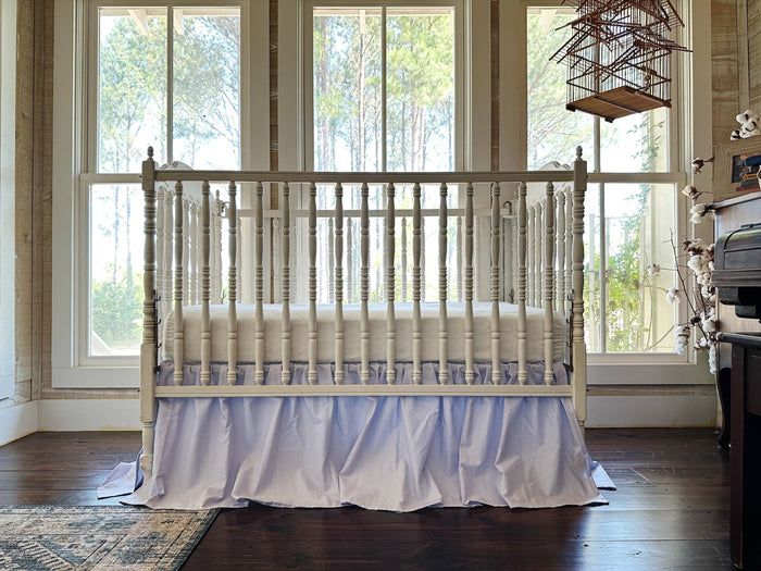 Lavender farmhouse crib skirt in washed cotton, 20-inch drop gathered on all four sides