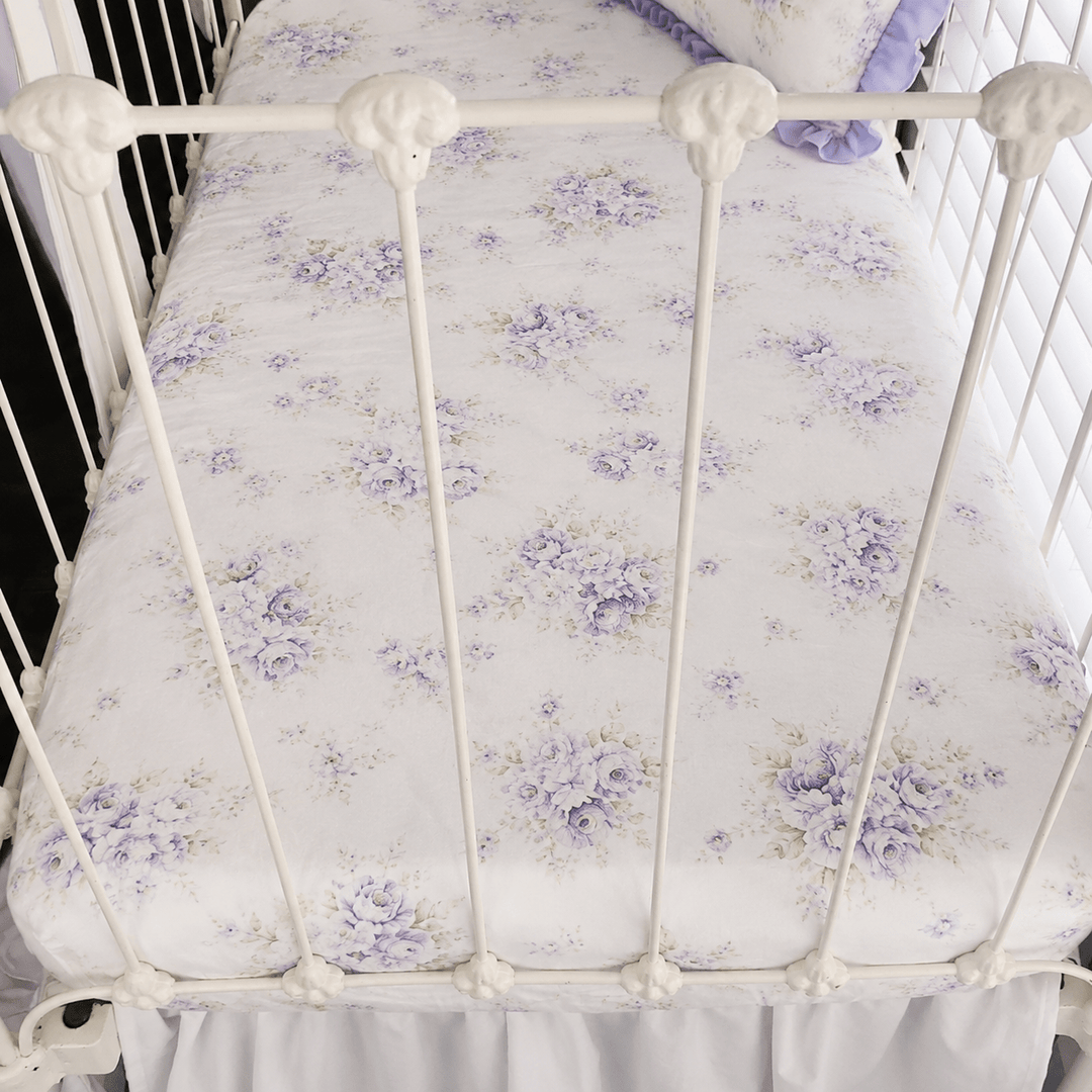 Lavender Shabby Chic Floral fitted crib sheet in washed cotton, fitted on a white iron crib mattress
