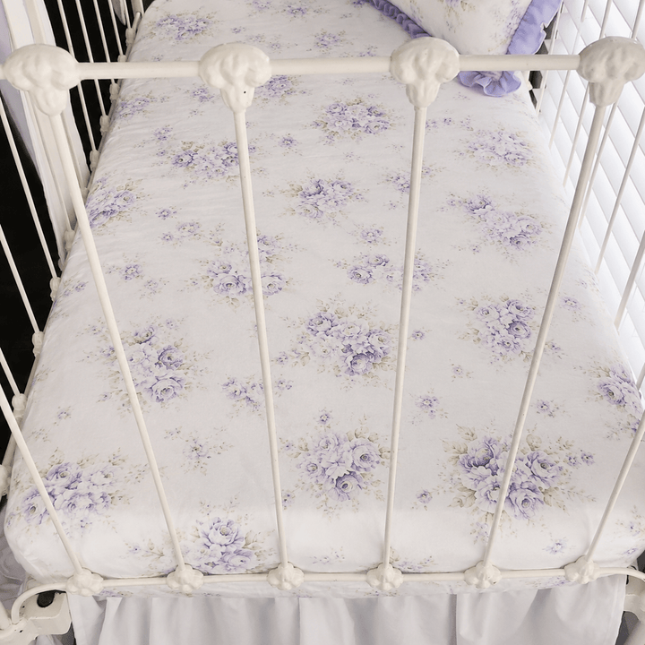 Lavender Shabby Chic Floral fitted crib sheet in washed cotton, fitted on a white iron crib mattress