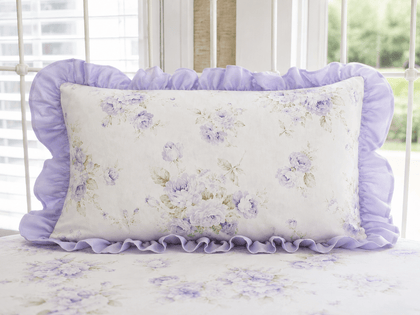 Lavender Shabby Chic Floral ruffled crib pillow with solid lavender ruffle, styled in a nursery crib
