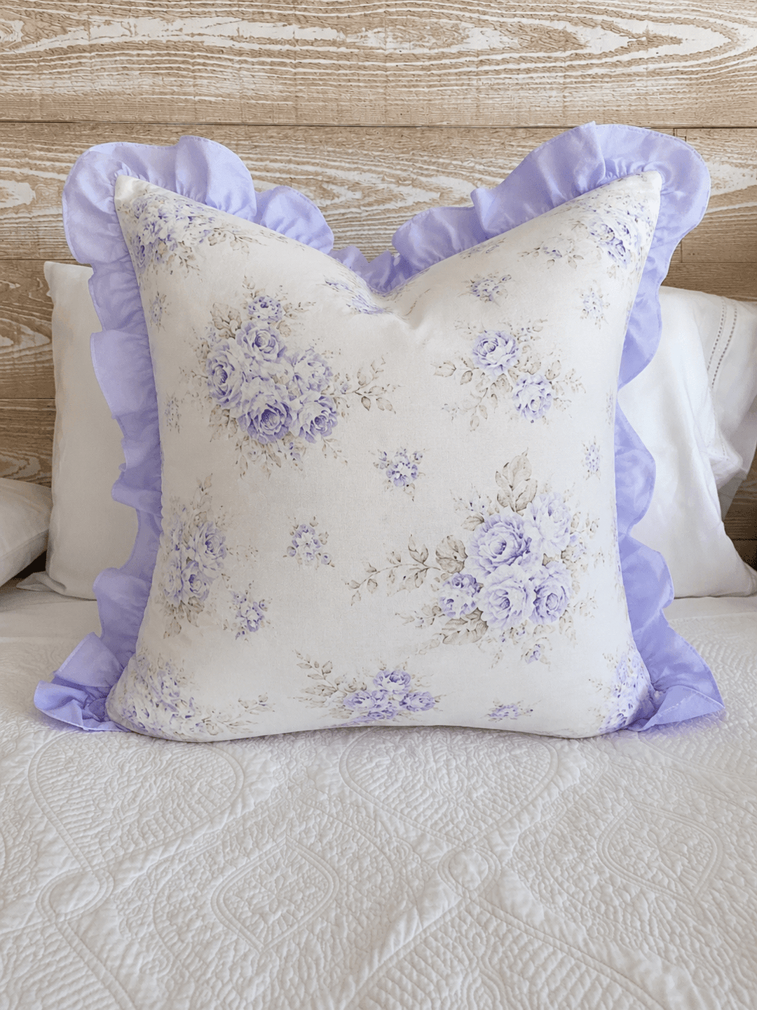 Lavender Shabby Chic Floral ruffled pillow sham with lavender ruffle border, styled on a bed