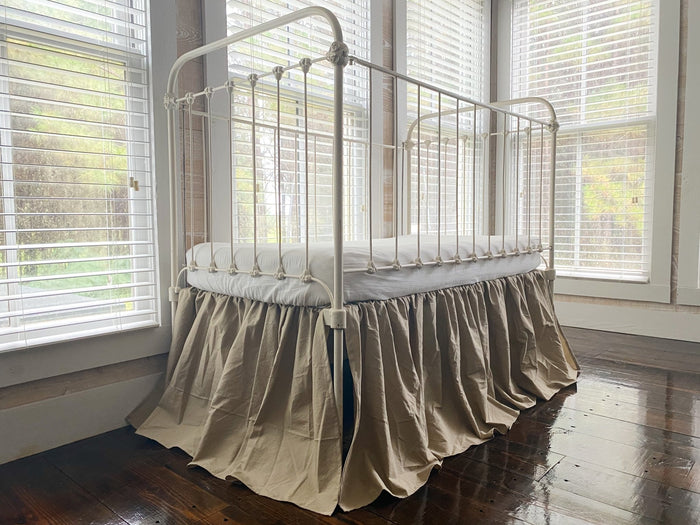 Oatmeal farmhouse crib skirt in washed cotton, 20-inch drop with split corners