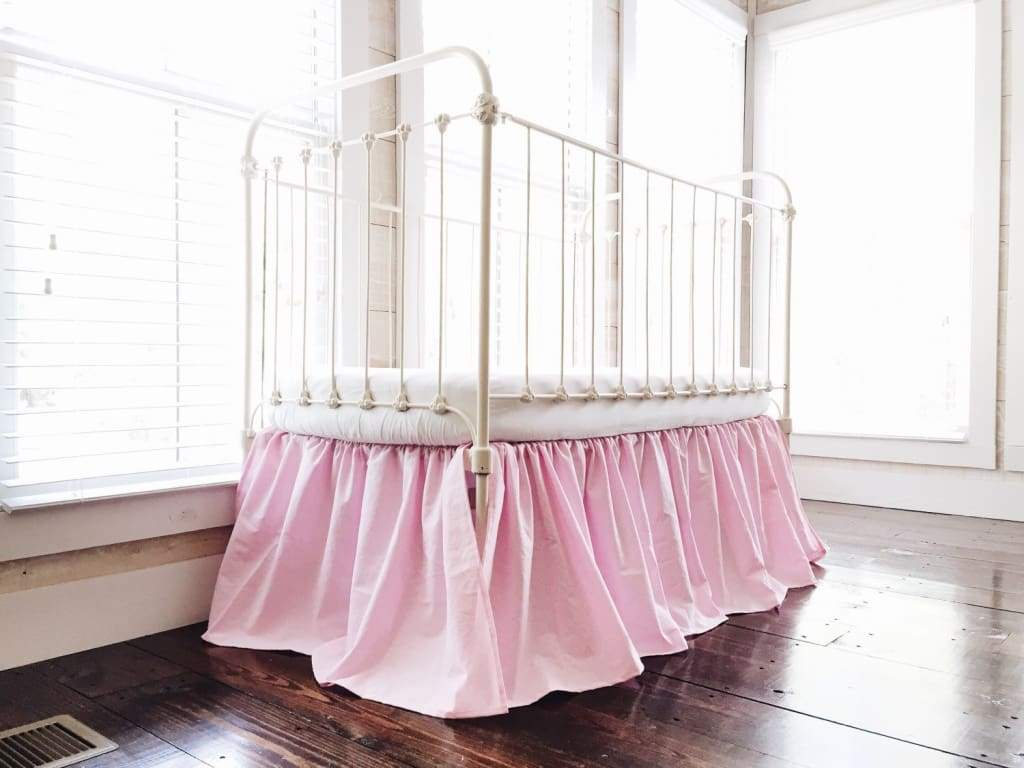 Bright pink farmhouse crib skirt