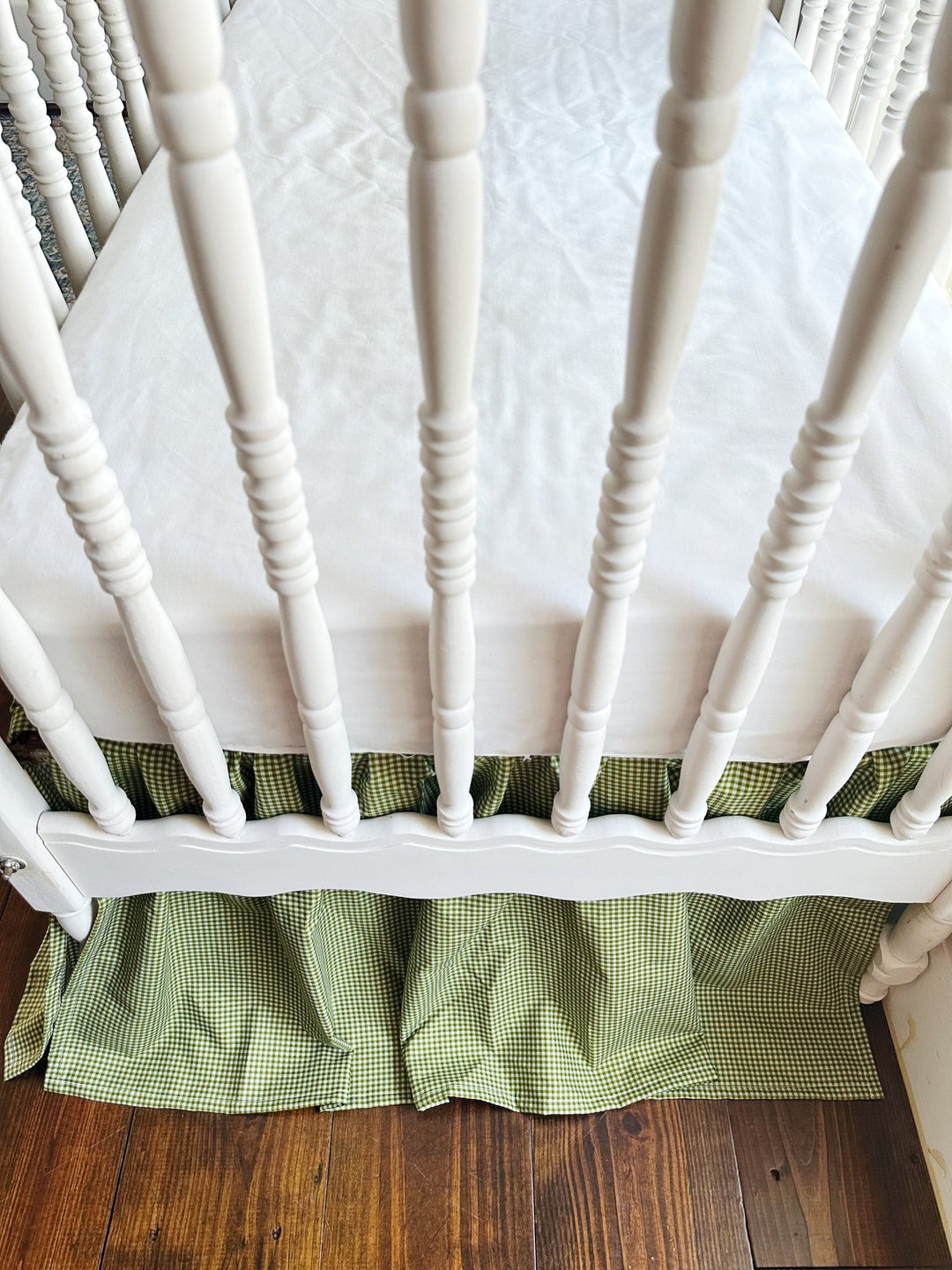 White fitted crib sheet paired with the pine green gingham gathered crib skirt
