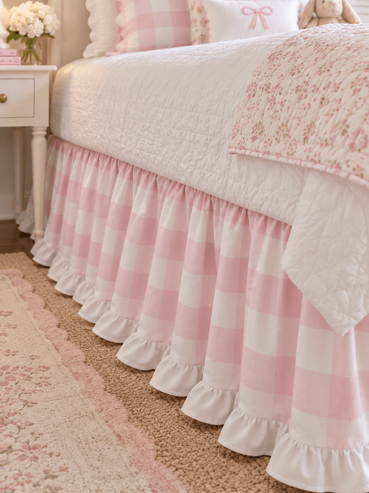 Close up of the pink buffalo check twin bed skirt showing the gathers and the white ruffle at the hem - High Cotton Textile