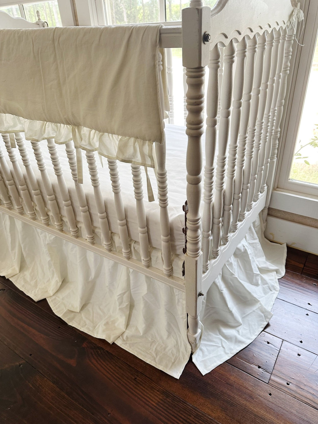 Angled view of the porcelain set showing the rail cover ties and the skirt falling to the floor